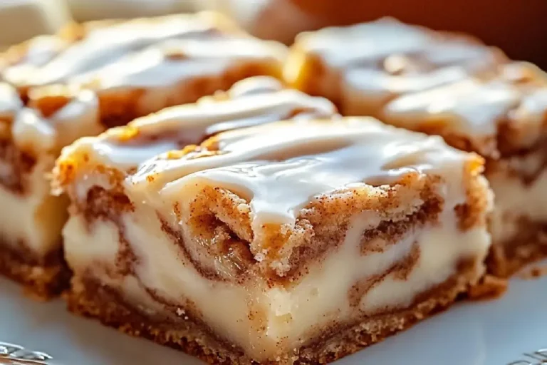 Cinnamon Roll Bliss Bars 2 Soft and gooey cinnamon roll bars drizzled with vanilla glaze, perfect for brunch or dessert.