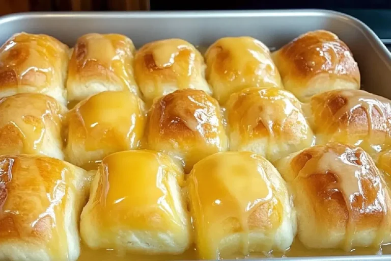 Orange Rolls with a Warm Sour Cream Butter Glaze 2 Freshly Baked Orange Rolls Topped with Creamy Warm Glaze